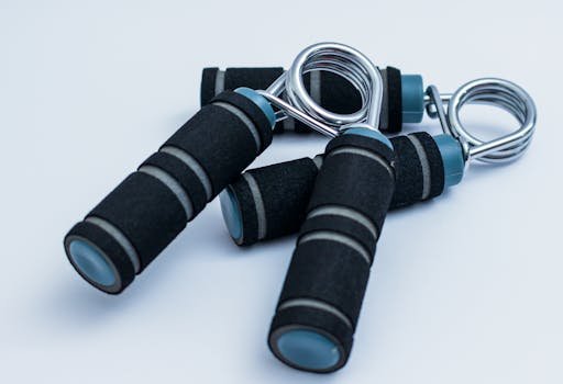 Close-up of foam handle hand grippers for enhancing grip strength during workouts.